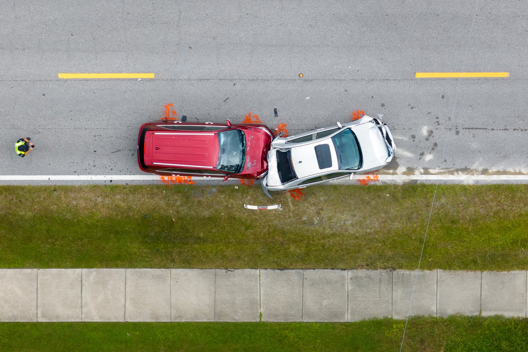 Two cars involved in a traffic accident on the road.
