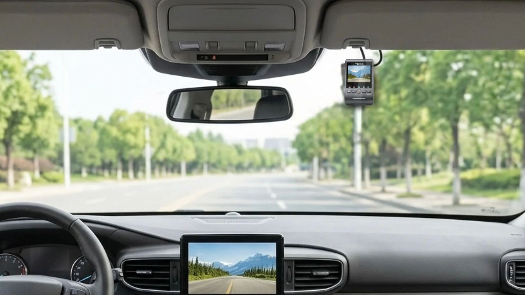 Wide windshield view with a VIOFO dash cam installed for front road recording