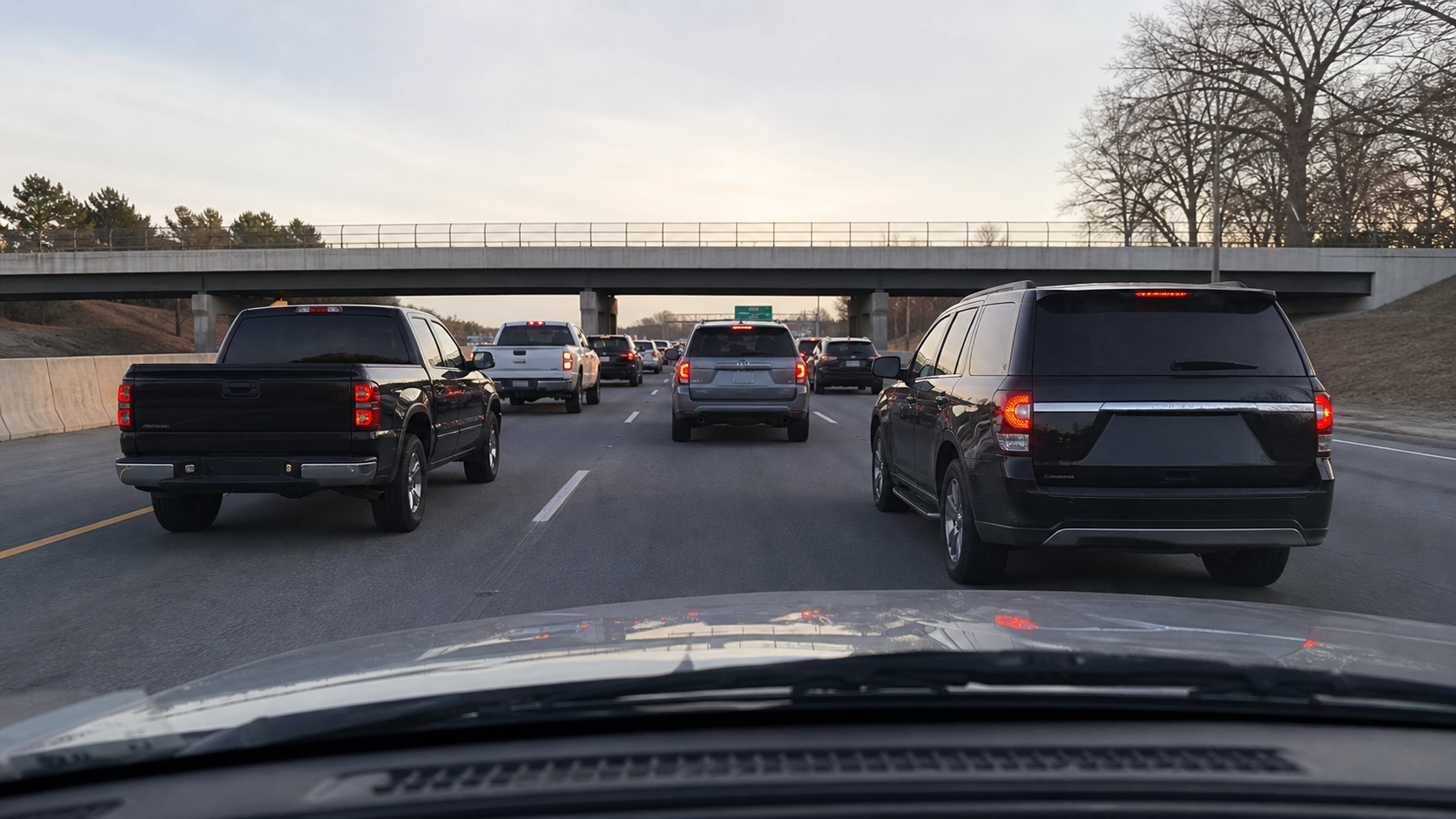 Interstate traffic viewed from inside a vehicle with no visible camera hardware