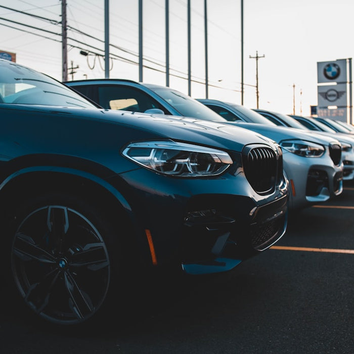 a row of cars parked in a parking lot