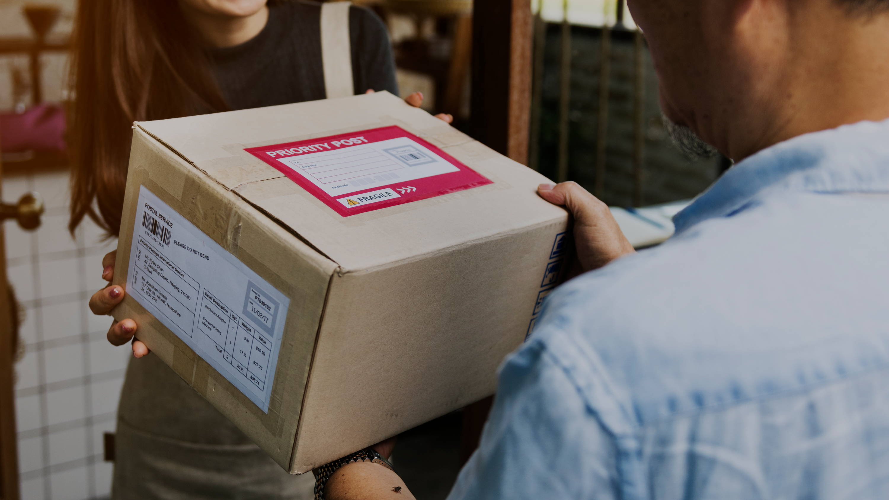 A parcel being handed to a customer