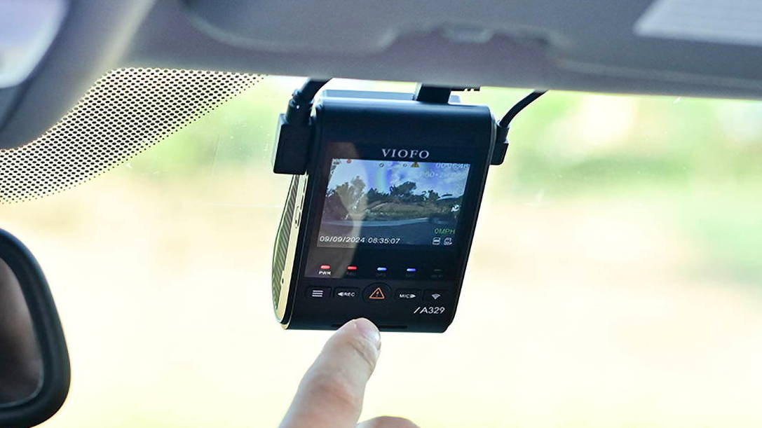 A VIOFO dash cam installed on a windshield